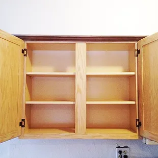 Kitchen cupboard interiors scrubbed clean.