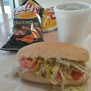 a sandwich and a drink on a table