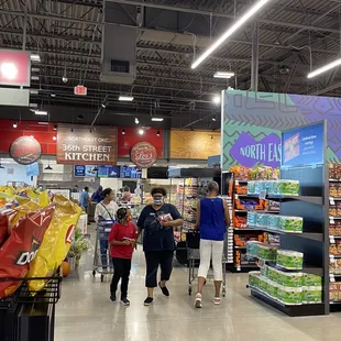 people shopping in a grocery store