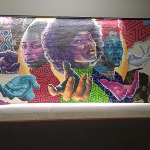 One of the new murals on outside. Someone explain the hands to me plz