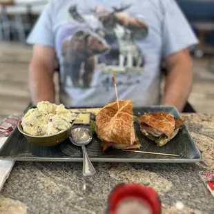 Club sandwich with potato salad
