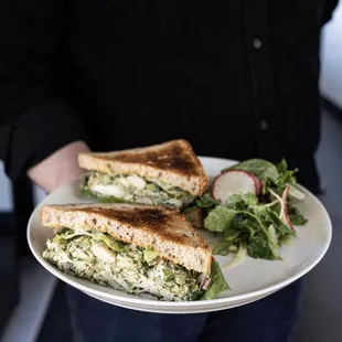 a man holding a plate of food