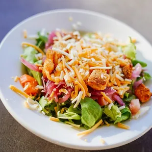 a salad in a white bowl