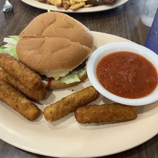 Double Cheeseburger with lettuce, ketchup and mayo. mozzarella sticks with marinara dipping sauce