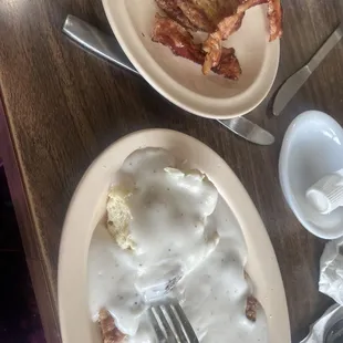 Biscuits And gravy with a side of sausage and bacon