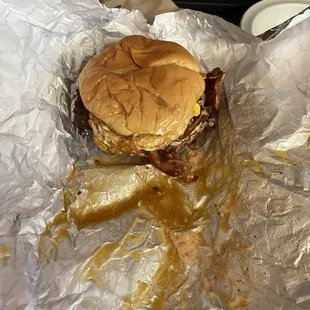 Burger in puddle of grease