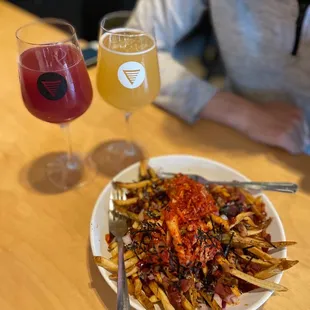 a plate of fries and a glass of beer