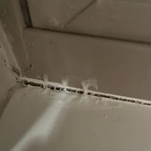 The window in the master bedroom. Has ice as well as moisture on it. The house was built in 2020.