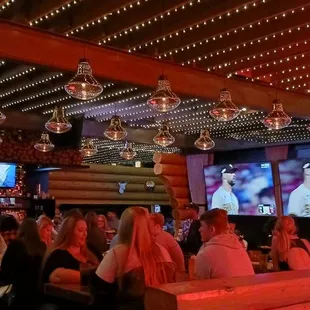 a large group of people sitting in a restaurant