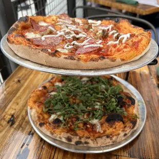 Two individual pizzas (Maximus top, Plato bottom)