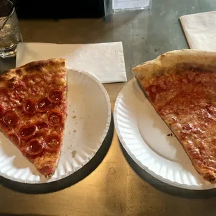 Slice of pepperoni and slice of cheese pizza from their food truck.