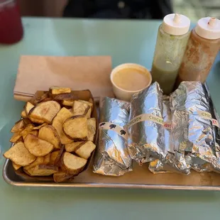 Potatoes and Lil&apos; Queso with Tijuana Panther, Chicken, brisket tacos