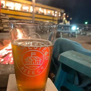 a glass of beer on a table