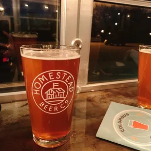 two pints of beer on a table