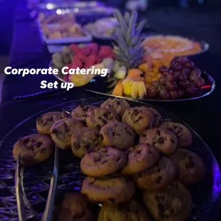 a table full of cookies and fruit