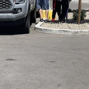 Poor kids hiding under a tree scared.