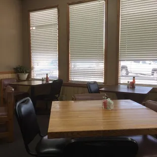 a dining room with a table and chairs