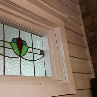 Stained glass windows above our booth on the indoor front porch.