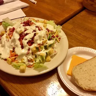 From the salad bar, notice the slice of cheese and sliced bread