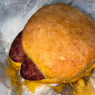 Smoked beef sausage egg and cheese on sweet potato biscuit.