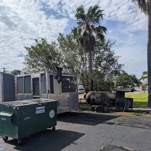 a truck and trailer parked in a parking lot