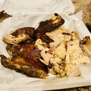 a plate of chicken and sides