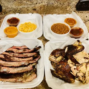 two trays of meat and sides