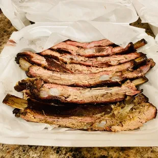 a plate of ribs and sides