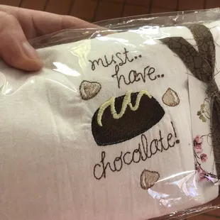 a person holding a bag of chocolate