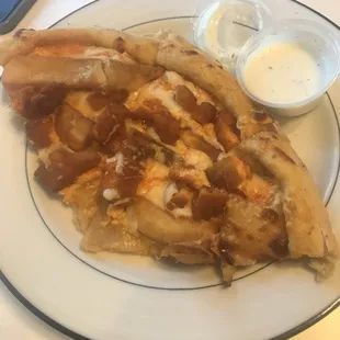 a slice of pizza on a plate