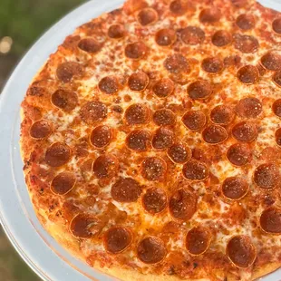 a pepperoni pizza on a plate