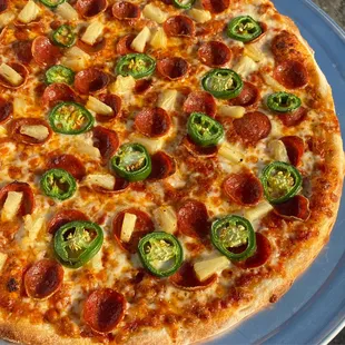 a pepperoni and jalapeno pizza