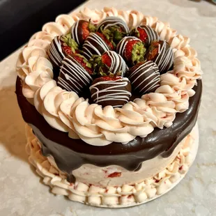 a chocolate cake with strawberries on top