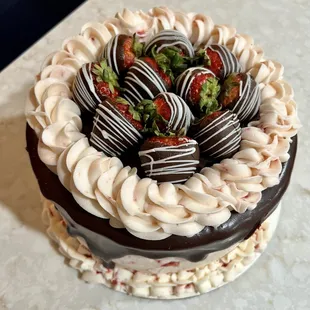 a chocolate cake with strawberries on top