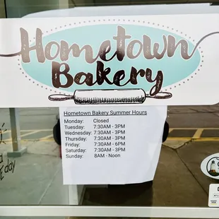 a sign on the door of a bakery