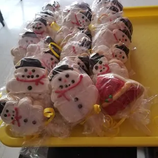 a tray of frosted snowmen