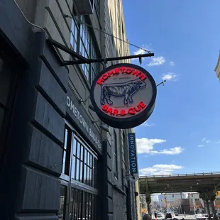 ows a neon sign for a bar