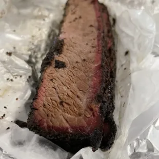 ows a piece of meat wrapped in foil