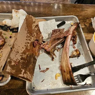 What we threw out.  Note - They only give you 3 Korean ribs (left we left 50%) beef rib we ate about 40% , mac &amp; cheese we left 80%