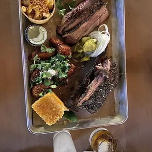 Smoked Wings, Mac and Cheese, Beef Rib, 1/2 Brisket, 1pc cornbread, and lastly, a Woodford on the rocks and a Mezcal Grapefruit Cocktail