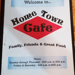 a sign on a wooden table