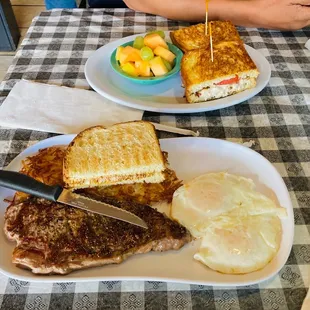 Steak &amp; eggs with toast, eggs over easy