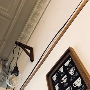 a framed picture of a coffee shop