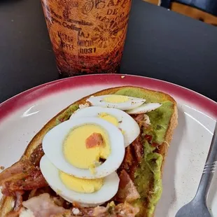 Loaded avocado toast and Latte with Oat milk.