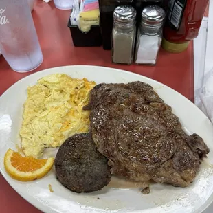 Ribeye steak and eggs with a side of sausage patty