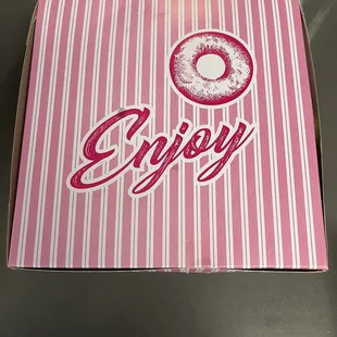 a pink box with a donut on it