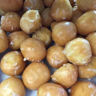 a pile of glazed donuts
