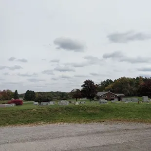 a view of a cemetery in a rural area