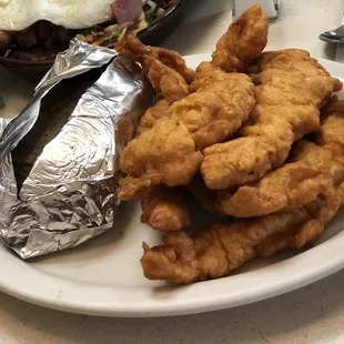 Home style Chicken Tenders and baked potato, comes with soup or salad and dessert for only $8.95. Can't be beat.