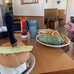 a burger and french fries on a table